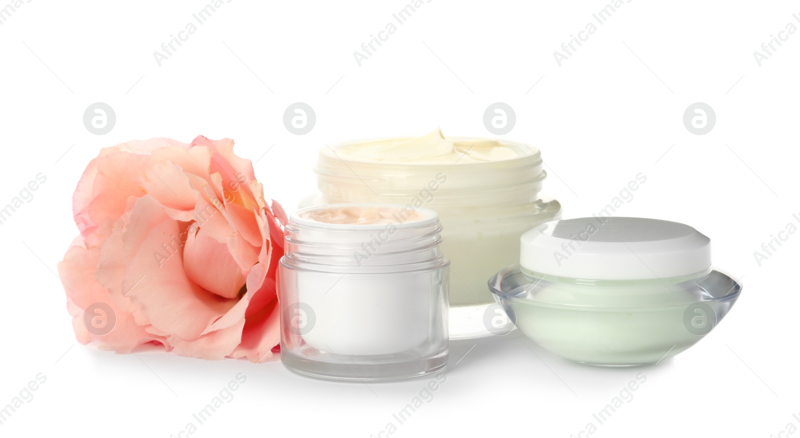 Photo of Jars with cream on white background. Hand care cosmetics