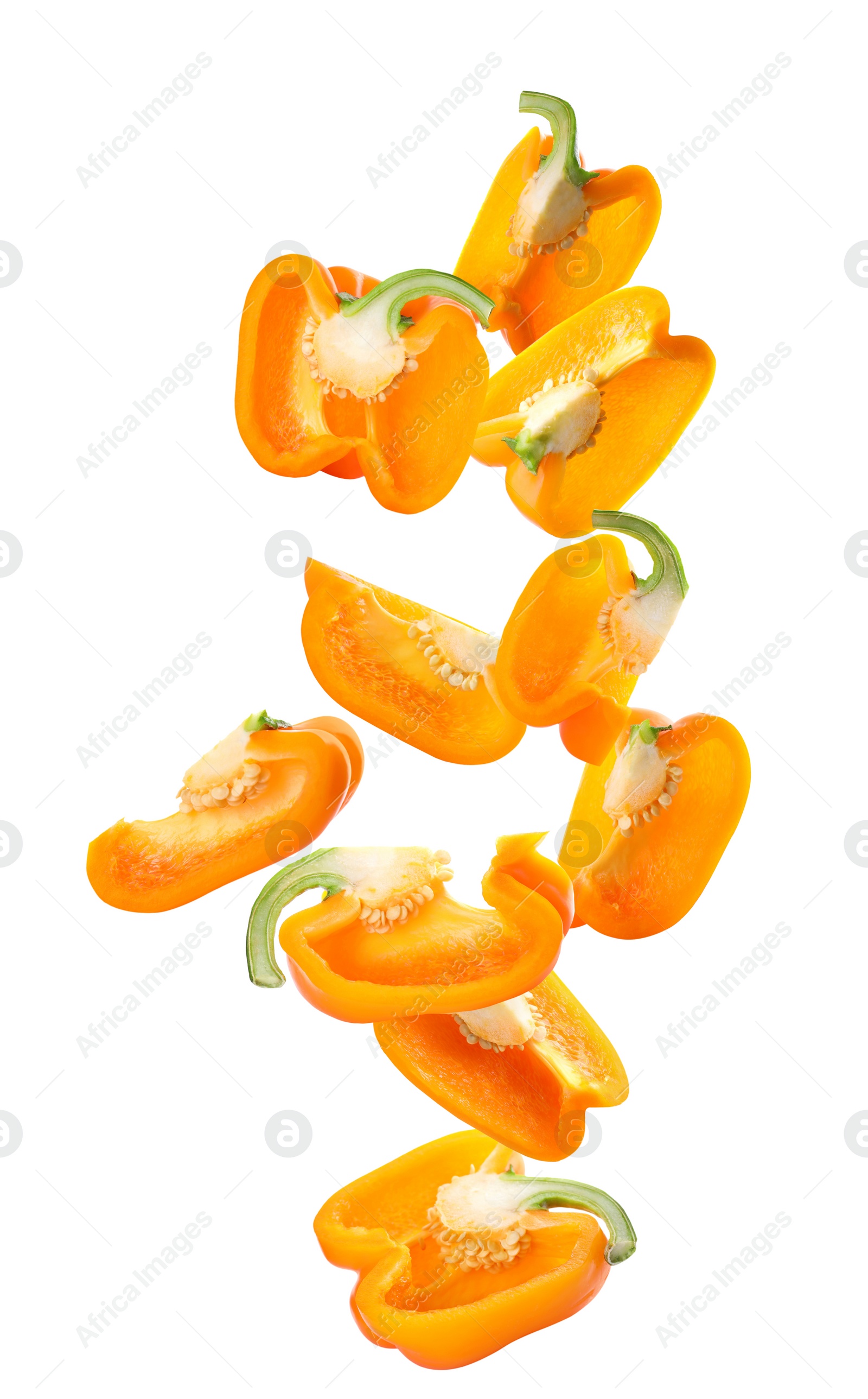 Image of Falling cut ripe orange bell peppers on white background