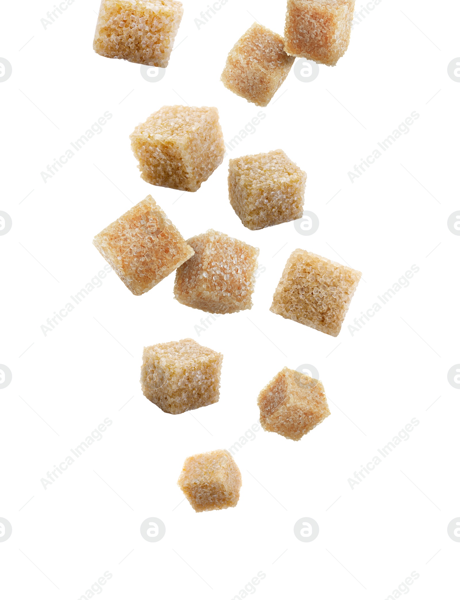 Image of Brown cane sugar cubes falling on white background