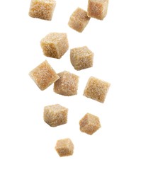 Image of Brown cane sugar cubes falling on white background