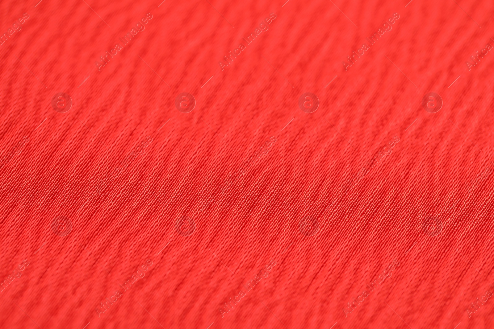 Photo of Texture of soft red fabric as background, closeup