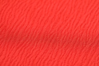 Photo of Texture of soft red fabric as background, closeup