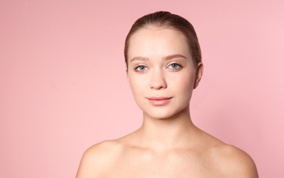 Photo of Portrait of beautiful young woman on color background. Lips contouring, skin care and cosmetic surgery concept