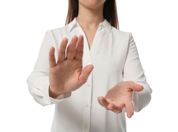 Businesswoman touching something on white background, closeup