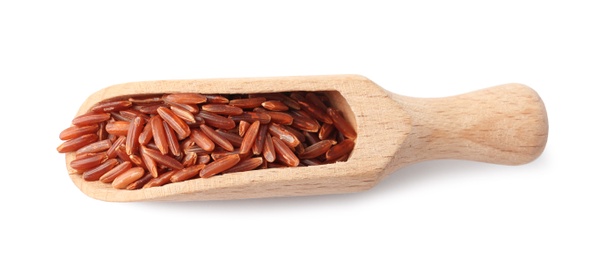 Photo of Scoop with uncooked brown rice on white background