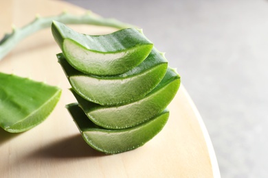 Fresh sliced aloe vera leaves on light table