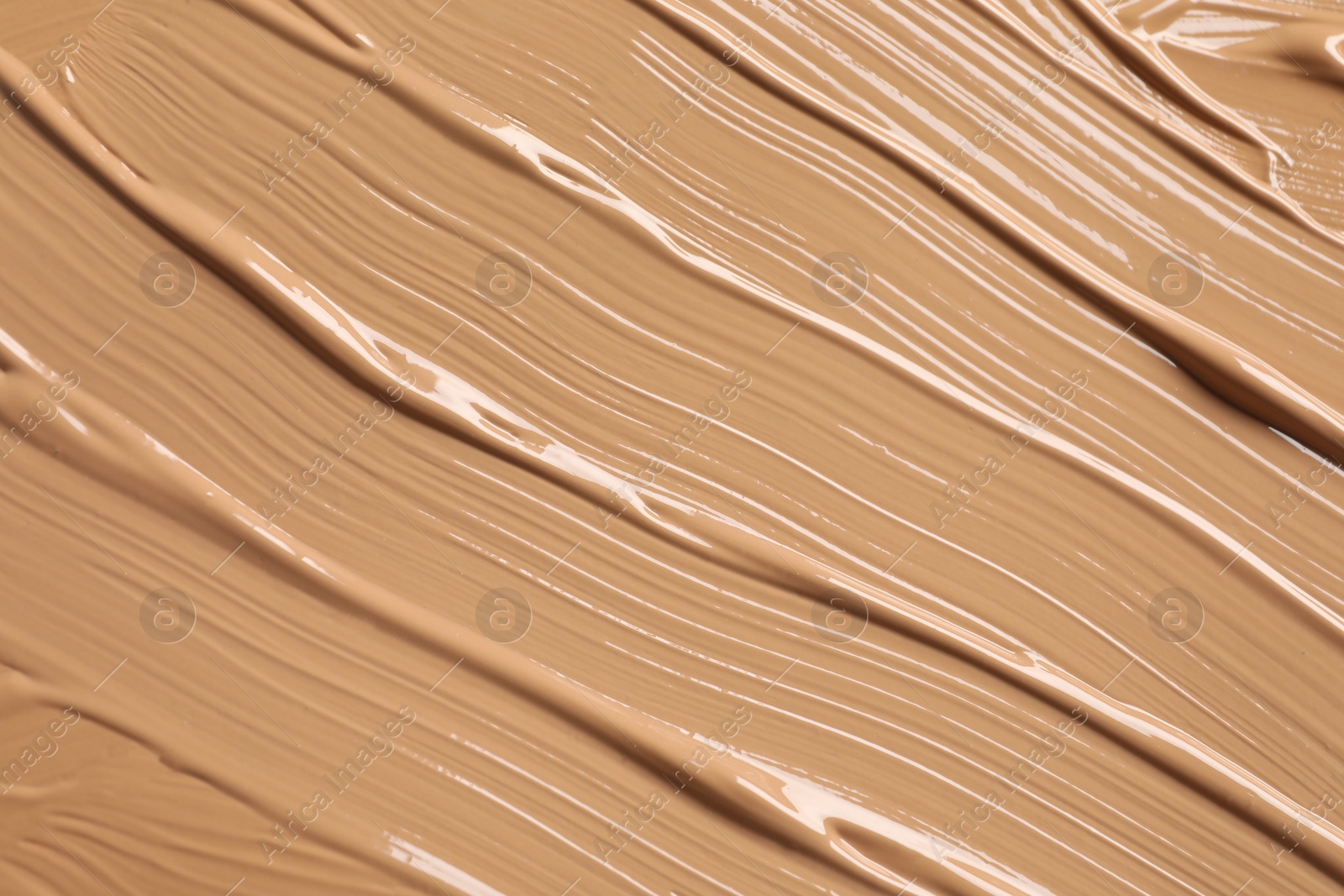 Photo of Texture of skin foundation as background, closeup