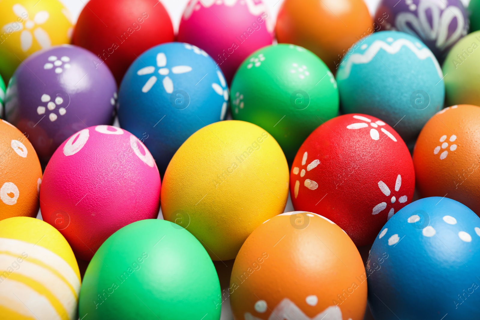 Photo of Colorful Easter eggs with different patterns as background, closeup