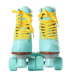 Photo of Pair of stylish quad roller skates on white background