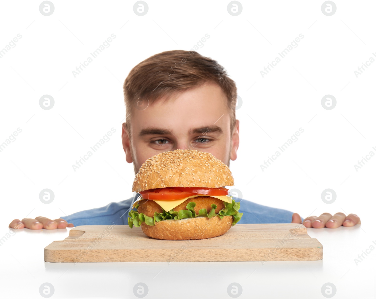 Photo of Young man and tasty burger on white background