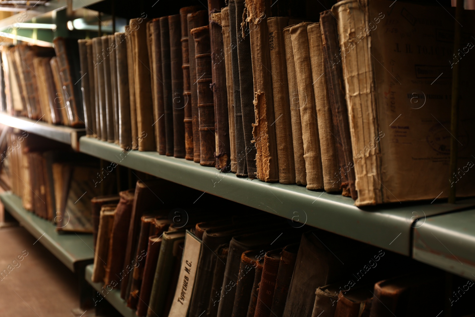 Photo of Collection of old books on shelves in library