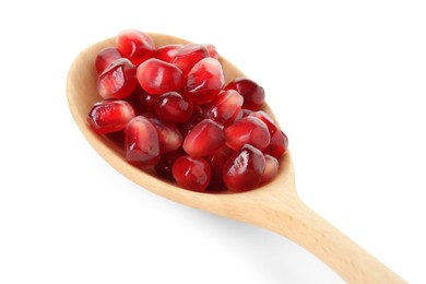 Photo of Ripe juicy pomegranate grains in wooden spoon isolated on white, closeup