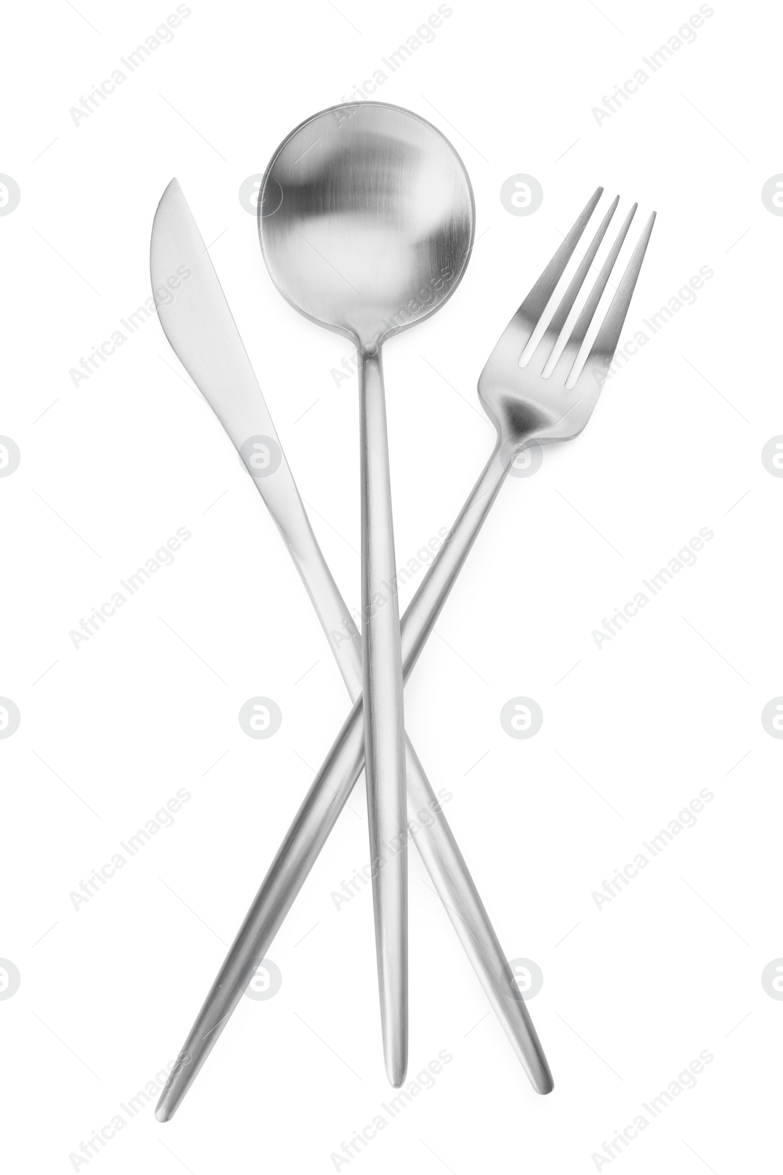 Photo of Shiny silver fork, spoon and knife isolated on white. Luxury cutlery set