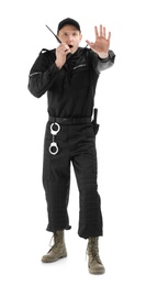 Male security guard using portable radio transmitter on white background