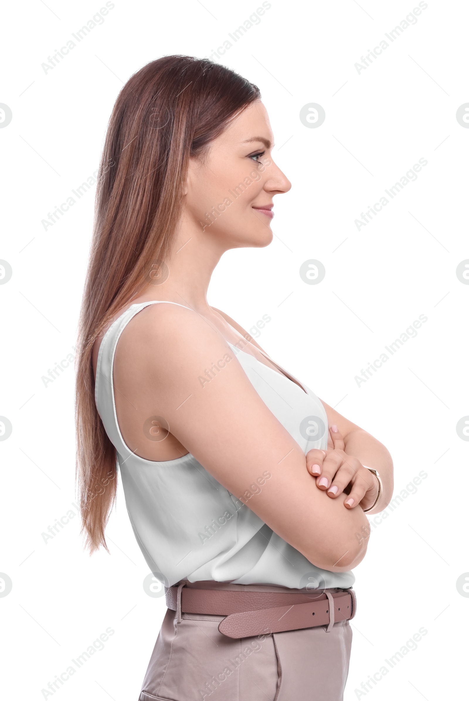 Photo of Beautiful happy businesswoman crossing arms on white background