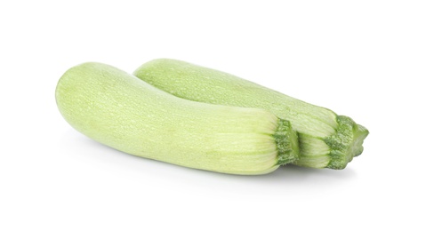 Raw green ripe zucchinis isolated on white