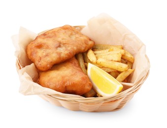 Photo of Tasty fish, chips and lemon in wicker bowl isolated on white