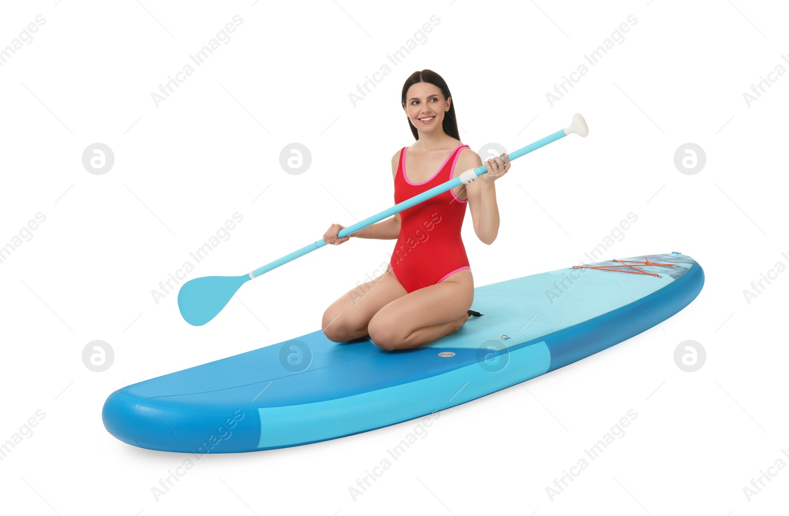 Photo of Happy woman with paddle on blue SUP board against white background