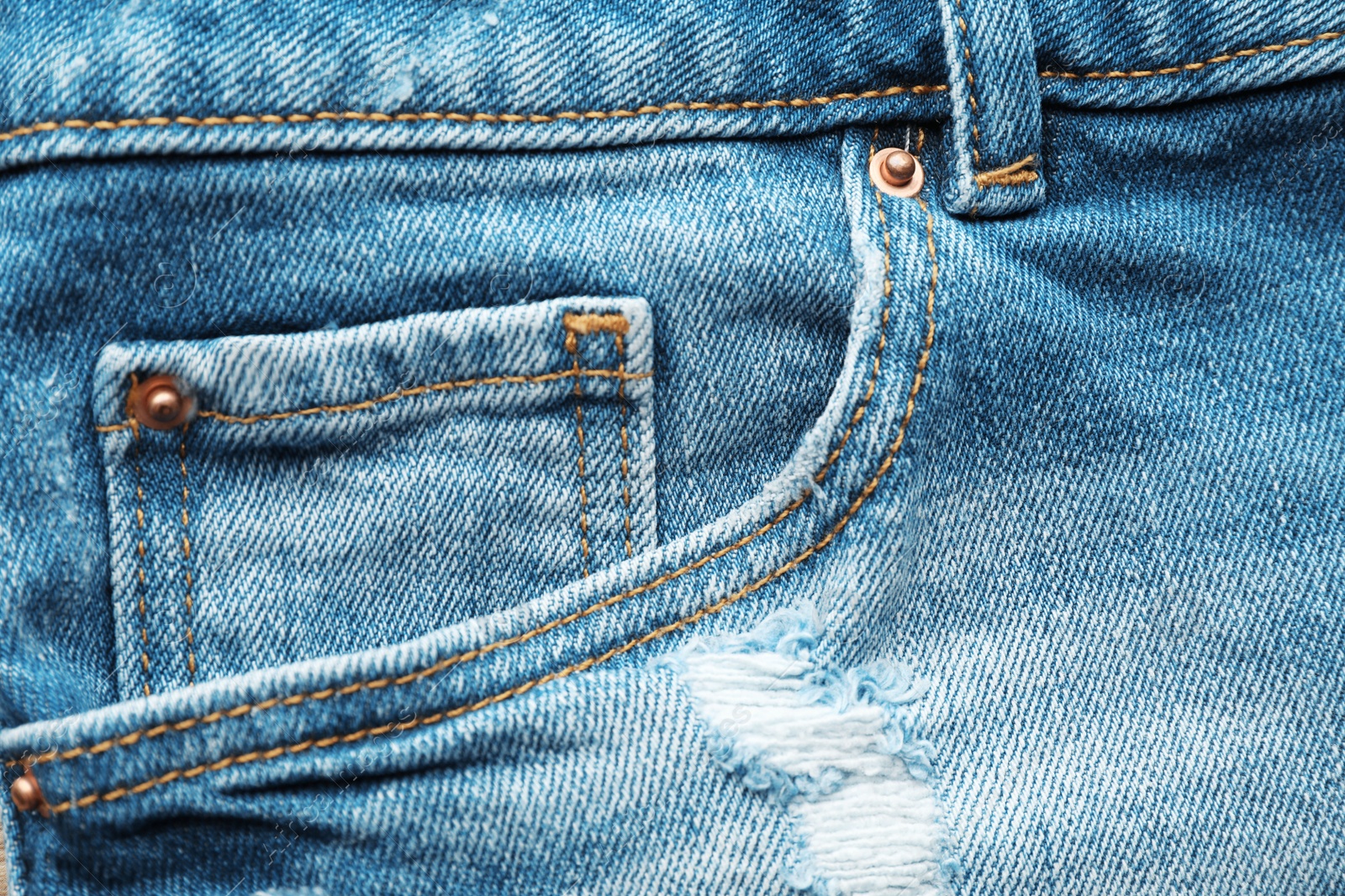 Photo of Closeup view of jeans pocket as background