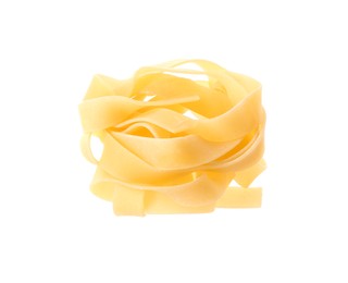 Raw fettuccine pasta nest isolated on white