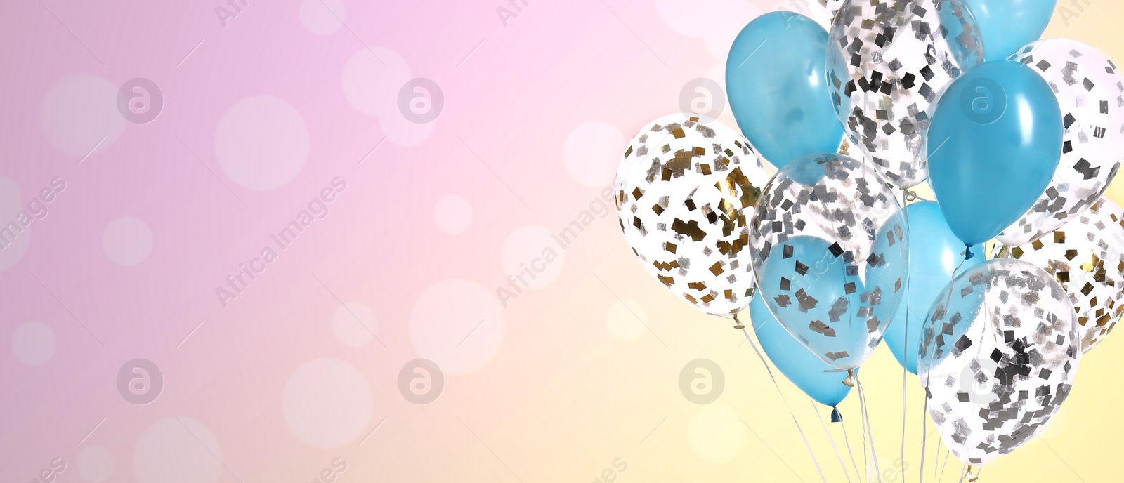 Image of Bright balloons on color background with bokeh effect, space for text. Banner design