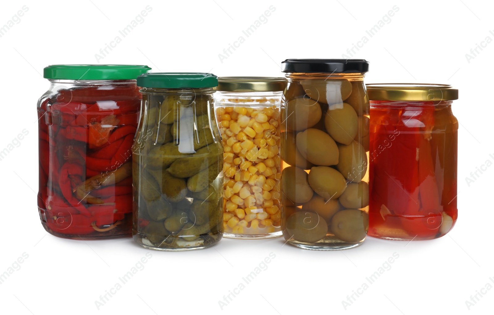 Photo of Glass jars of different pickled vegetables isolated on white