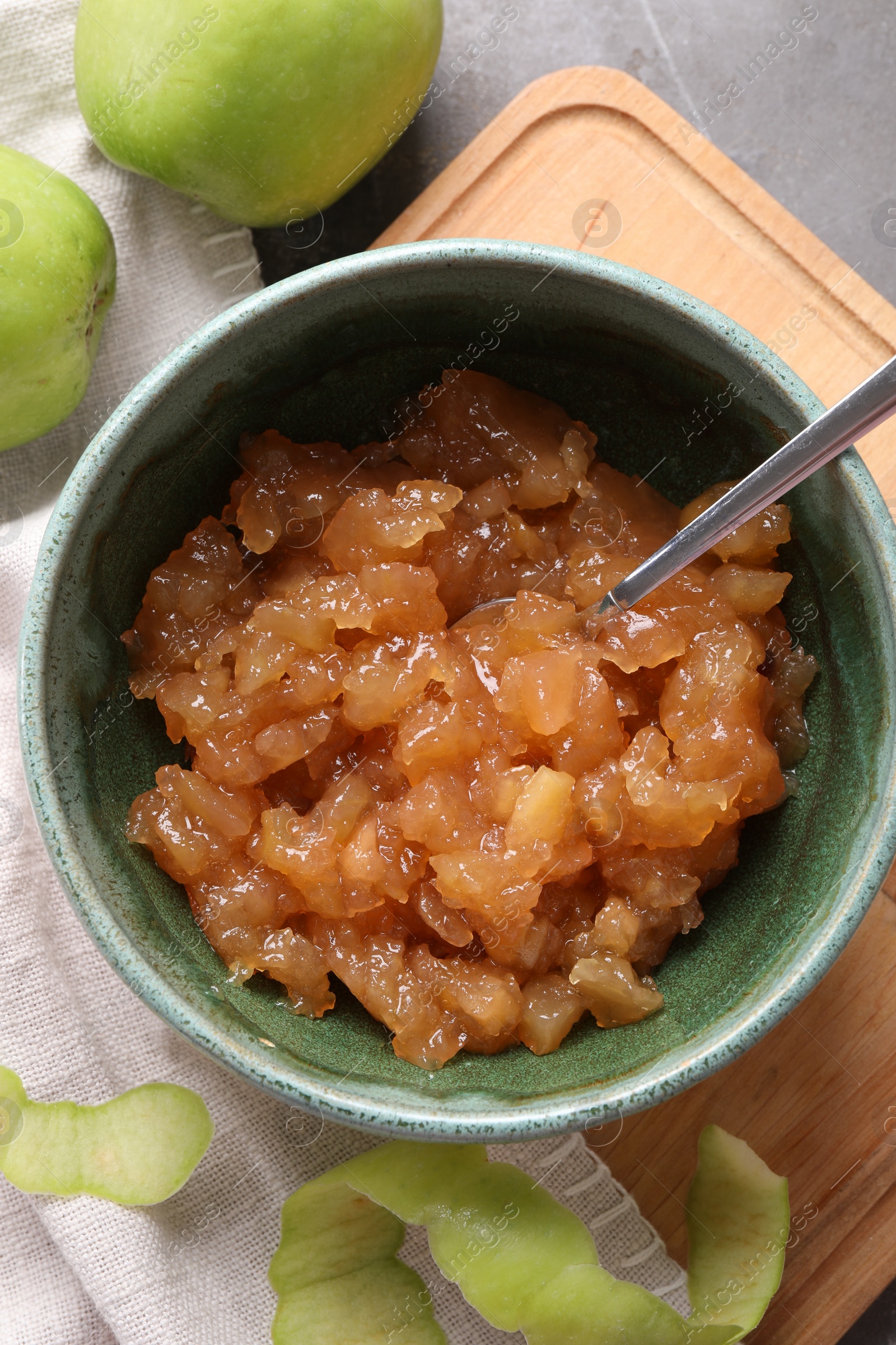 Photo of Delicious apple jam and fresh fruits on grey table, flat lay