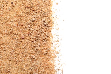 Photo of Pile of fresh bread crumbs on white background, top view