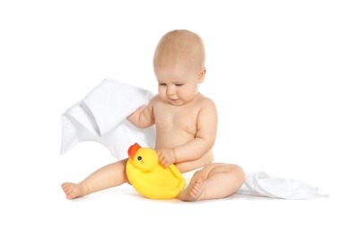 Photo of Cute little baby with soft towel and toy duck on white background