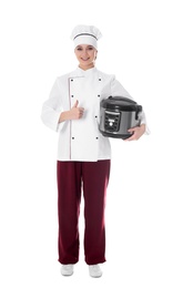 Full length portrait of female chef with modern multi cooker on white background