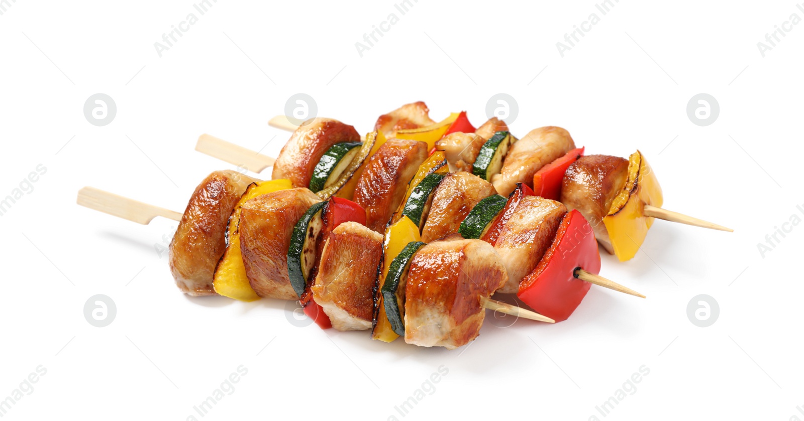 Photo of Delicious chicken shish kebabs with vegetables on white background