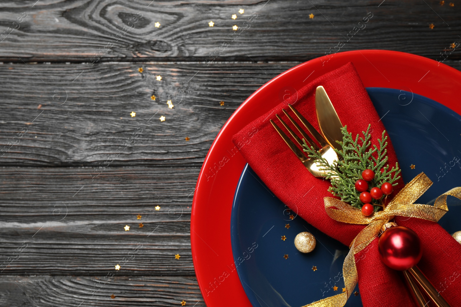 Photo of Beautiful Christmas table setting on wooden background, top view