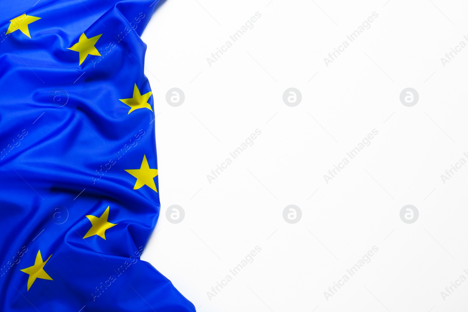 Photo of Flag of European Union on white background, top view. Space for text