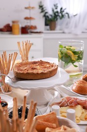 Dishes with different food on table in room. Luxury brunch