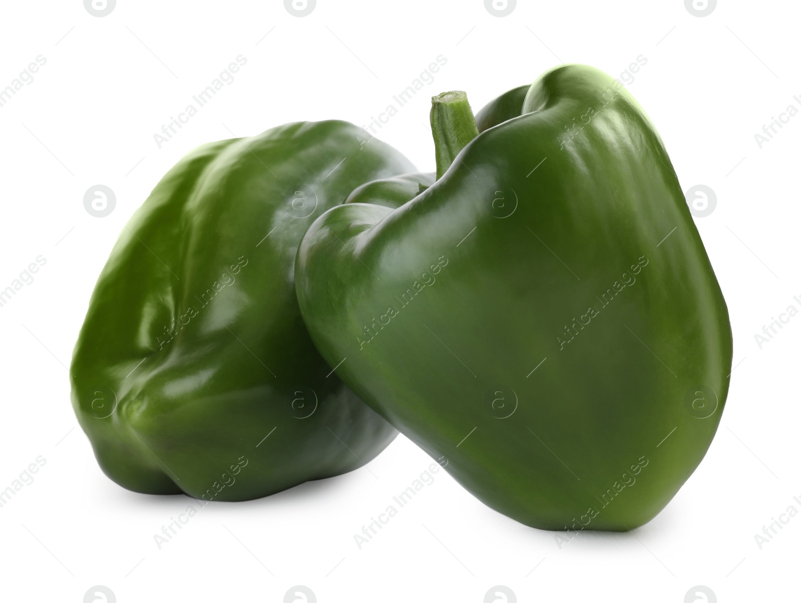 Photo of Ripe green bell peppers isolated on white