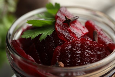 Photo of Delicious pickled beets in jar, closeup view