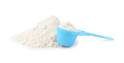 Photo of Powdered infant formula and scoop  on white background. Baby milk