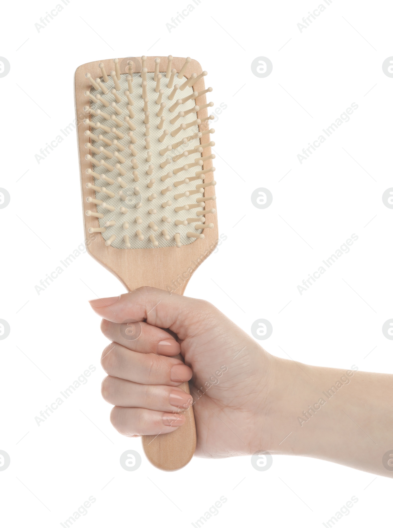 Photo of Woman holding wooden hair brush on white background, closeup