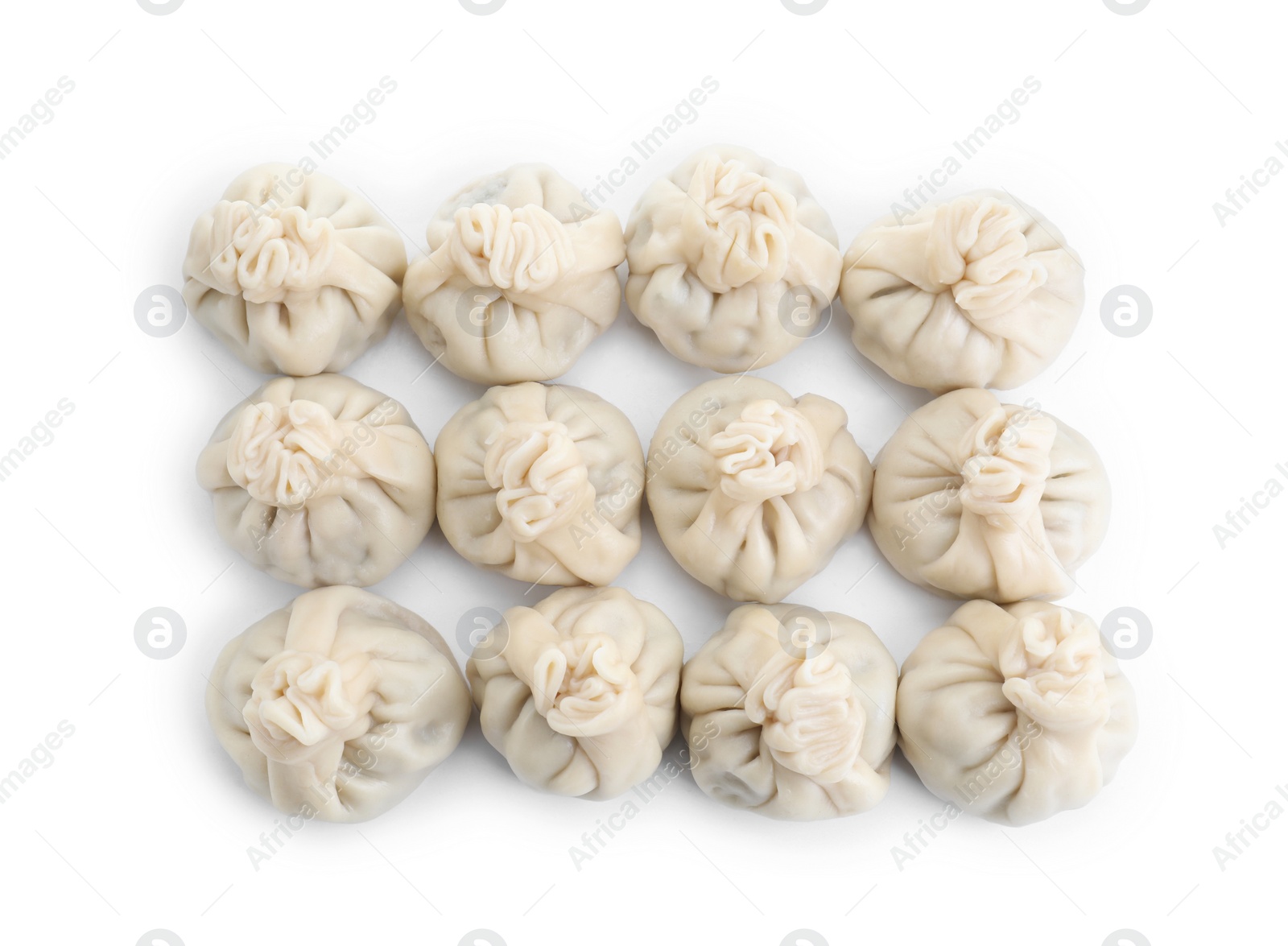 Photo of Many tasty khinkali (dumplings) isolated on white, top view. Georgian cuisine