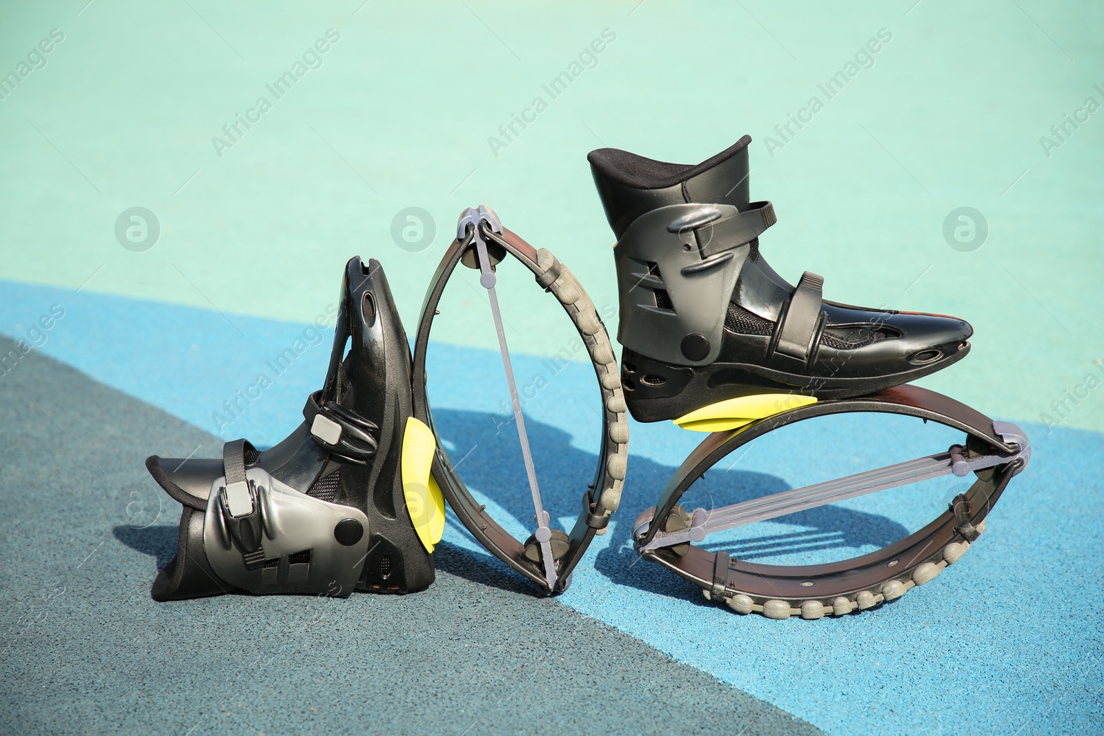 Photo of Stylish kangoo jumping boots on color textured background