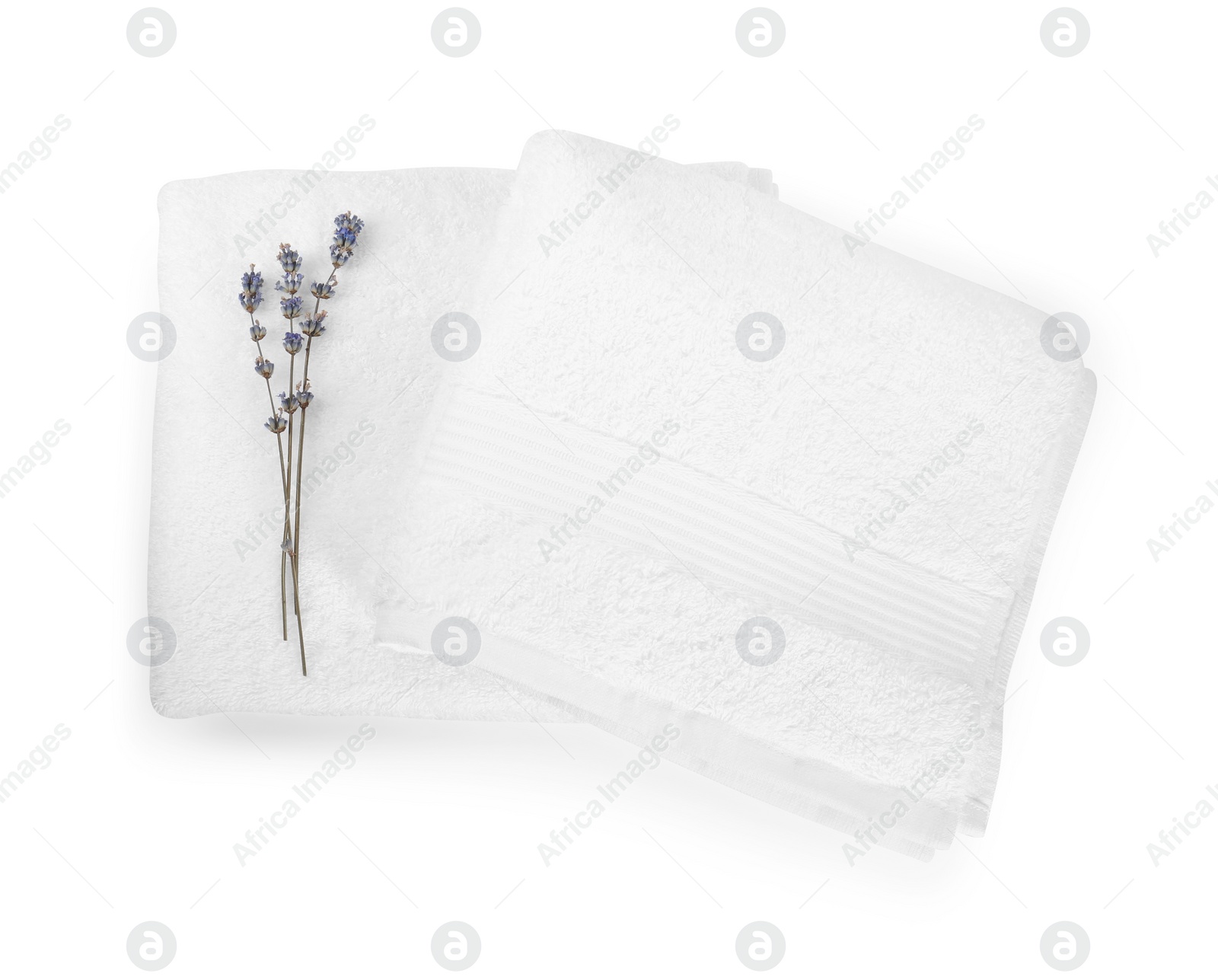 Photo of Terry towels and lavender flowers isolated on white, top view