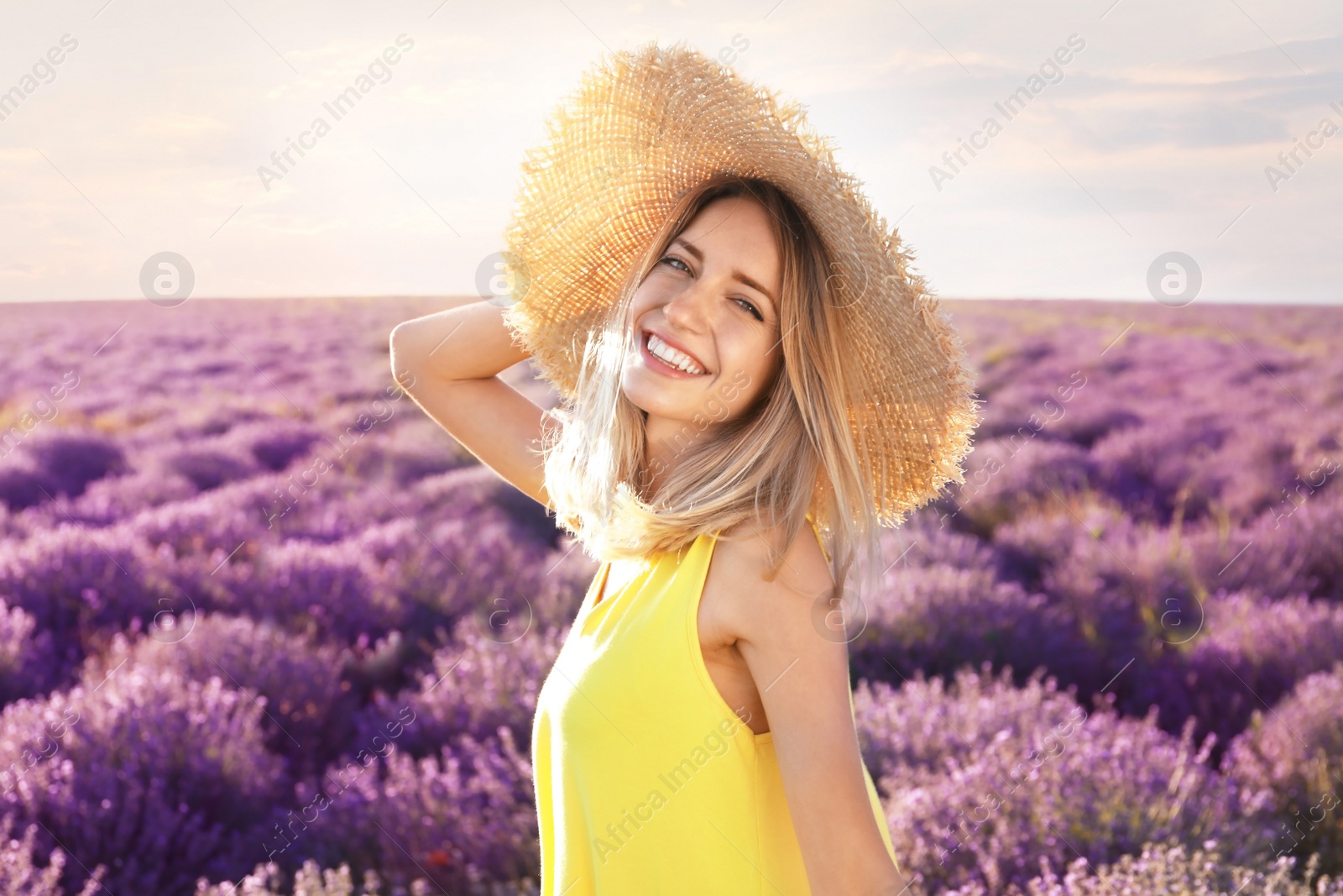 Photo of Young woman in lavender field on summer day