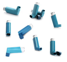 Set with portable asthma inhalers on white background