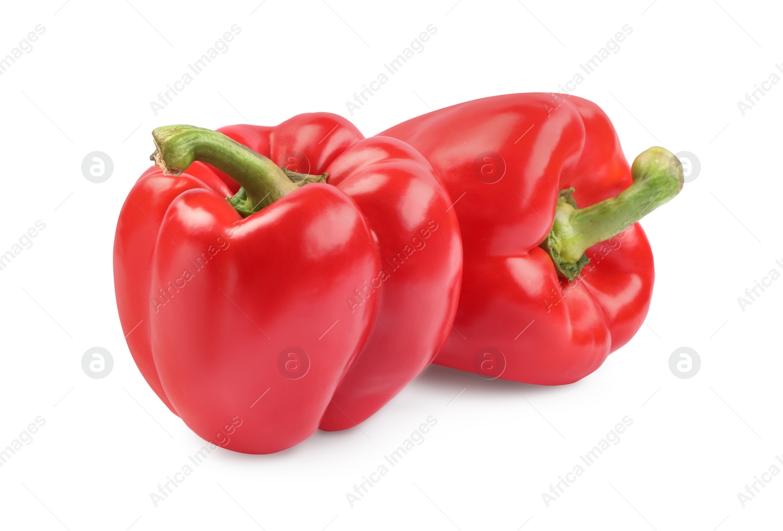 Photo of Ripe red bell peppers isolated on white