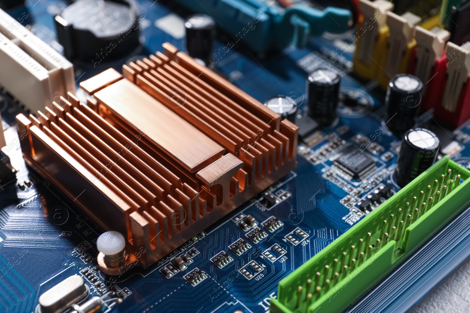 Photo of Computer motherboard as background, closeup. Electronic device