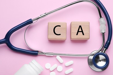 Photo of Stethoscope, pills and calcium symbol madewooden cubes with letters on pink background, flat lay