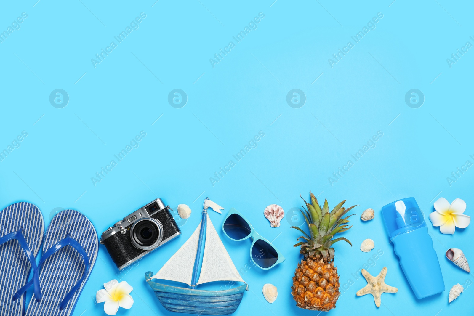 Photo of Flat lay composition with beach accessories on color background, space for text