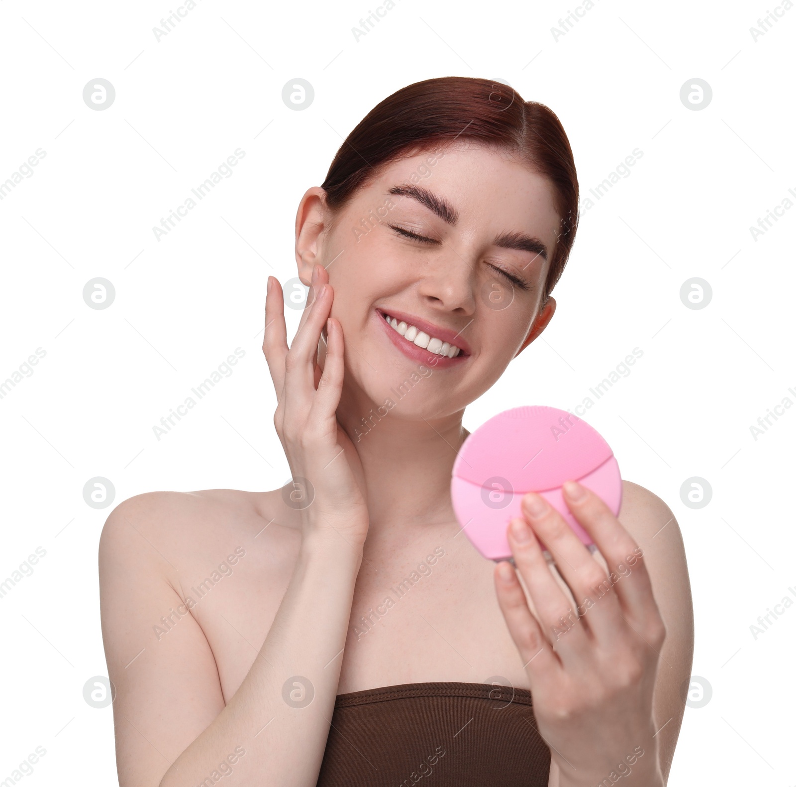 Photo of Washing face. Young woman with cleansing brush on white background