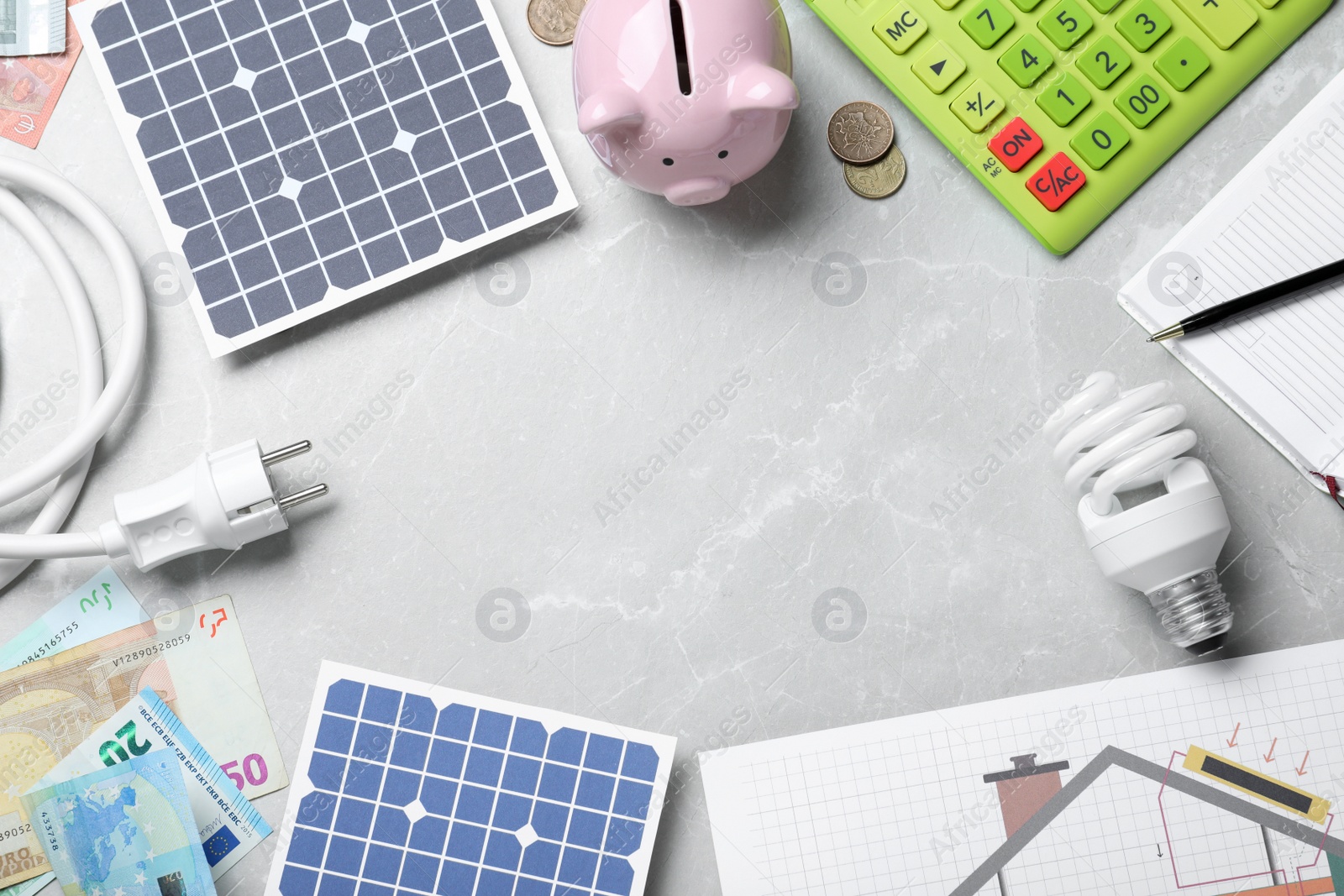 Photo of Flat lay composition with solar panels on marble table. Space for text