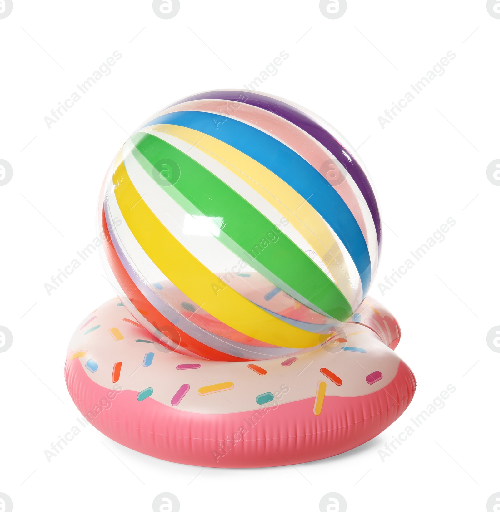 Photo of Bright inflatable ring and ball on white background. Summer holidays